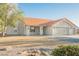 Charming single-story home with a terracotta tile roof and three-car garage at 1601 Iguana St, Pahrump, NV 89048