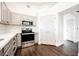 Well-lit kitchen featuring stainless steel appliances and ample cabinet space at 1601 Iguana St, Pahrump, NV 89048