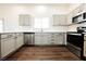 Modern kitchen featuring stainless steel appliances and sleek countertops at 1601 Iguana St, Pahrump, NV 89048