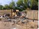 Backyard showing debris and an unkempt yard at 1655 N Gateway Rd, Las Vegas, NV 89115