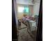 Bedroom features a bed and natural light with a ceiling fan at 1655 N Gateway Rd, Las Vegas, NV 89115