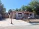 Exterior view of a single story home with a fenced yard and driveway at 1655 N Gateway Rd, Las Vegas, NV 89115
