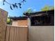Exterior of fire-damaged home with burnt window, roof damage, and boarded up window at 1655 N Gateway Rd, Las Vegas, NV 89115