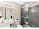 Bathroom featuring a modern sink and shower with sleek gray tile at 2040 Bavington Dr # D, Las Vegas, NV 89108