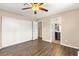 Neutral-toned bedroom featuring wood floors, and an ensuite bathroom at 2040 Bavington Dr # D, Las Vegas, NV 89108