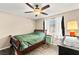 Cozy bedroom with laminate flooring, ceiling fan and ample natural light at 2040 Bavington Dr # D, Las Vegas, NV 89108