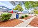 Charming exterior view of a well-maintained home with blue accents and lush landscaping at 2040 Bavington Dr # D, Las Vegas, NV 89108
