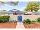 Charming home featuring a blue gate and well-maintained landscaping, creating an inviting curb appeal at 2040 Bavington Dr # D, Las Vegas, NV 89108