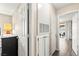 Hallway with neutral walls, wood-look flooring and access to various rooms at 2040 Bavington Dr # D, Las Vegas, NV 89108