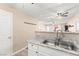 Kitchen sink with faucet and countertop view overlooking an open living area and kitchen at 2040 Bavington Dr # D, Las Vegas, NV 89108