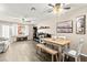 Bright living room featuring wood floors, a dining table and a lot of natural light at 2040 Bavington Dr # D, Las Vegas, NV 89108