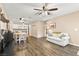 Bright living room with wood floors, neutral paint and a view into the eat-in kitchen at 2040 Bavington Dr # D, Las Vegas, NV 89108