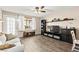 Relaxing living room featuring wood floors, modern decor, and lots of natural light at 2040 Bavington Dr # D, Las Vegas, NV 89108