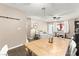 View of the living and dining areas featuring modern flooring, comfortable seating, and access to the outdoor patio at 2040 Bavington Dr # D, Las Vegas, NV 89108