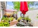 Charming patio with shade cover, potted plants, and seating area perfect for outdoor relaxation and entertaining at 2040 Bavington Dr # D, Las Vegas, NV 89108