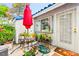 Charming patio area adorned with vibrant plants and flowers, perfect for outdoor relaxation at 2040 Bavington Dr # D, Las Vegas, NV 89108
