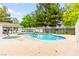 Refreshing community pool surrounded by lush landscaping and comfortable lounge chairs at 2040 Bavington Dr # D, Las Vegas, NV 89108