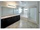 Bathroom featuring double sinks, a soaking tub, and a walk-in shower at 2332 Mundare Dr, Henderson, NV 89002