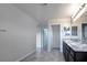Bright bathroom with double sinks, granite counters, and tile flooring at 2332 Mundare Dr, Henderson, NV 89002