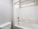 Clean white bathroom features a combination tub and shower at 2332 Mundare Dr, Henderson, NV 89002