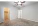 A bedroom with carpet features multiple doorway access to a walk-in closet at 2332 Mundare Dr, Henderson, NV 89002