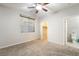 Bedroom offers carpet, a ceiling fan, and leads to the bathroom and walk-in closet at 2332 Mundare Dr, Henderson, NV 89002