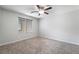 Neutral bedroom with a ceiling fan, one window with blinds and gray carpeting at 2332 Mundare Dr, Henderson, NV 89002