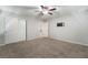 Neutral bedroom featuring wall mounted TV, walk-in closet, and ensuite bathroom at 2332 Mundare Dr, Henderson, NV 89002