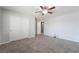 Neutral bedroom with walk-in closet, ensuite bathroom, and neutral carpeting at 2332 Mundare Dr, Henderson, NV 89002