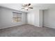Bright bedroom with two windows featuring blinds and neutral carpeting at 2332 Mundare Dr, Henderson, NV 89002