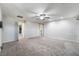 Large bonus room with carpet, ceiling fan, and neutral walls leads to secondary rooms at 2332 Mundare Dr, Henderson, NV 89002