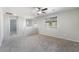 Spacious bonus room with neutral walls, carpet, ceiling fan, and natural light from windows at 2332 Mundare Dr, Henderson, NV 89002