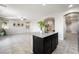 Modern kitchen island featuring granite countertops and dark cabinetry at 2332 Mundare Dr, Henderson, NV 89002