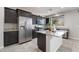 Modern kitchen featuring stainless steel appliances, granite countertops, and a kitchen island at 2332 Mundare Dr, Henderson, NV 89002