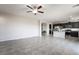 Open-concept living area with tile flooring, kitchen view, and ample natural light at 2332 Mundare Dr, Henderson, NV 89002