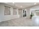 Spacious living room with tile floors, recessed lighting, and large windows at 2332 Mundare Dr, Henderson, NV 89002