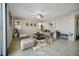 Bright living room featuring neutral tones, tile flooring, and modern decor at 2332 Mundare Dr, Henderson, NV 89002