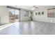 Bright, spacious living room features tile floors and a sliding glass door to the patio at 2332 Mundare Dr, Henderson, NV 89002