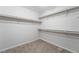 A walk-in closet with carpet features multiple levels of shelving and storage space at 2332 Mundare Dr, Henderson, NV 89002