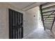 The apartment entrance features a security gate, a unit number, and is next to stairs that lead to the next floor at 2451 N Rainbow Blvd # 1066, Las Vegas, NV 89108