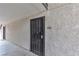 The apartment entrance features a security gate, a unit number, and is on a neutral-colored hallway at 2451 N Rainbow Blvd # 1066, Las Vegas, NV 89108