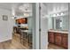 Open-concept living space showcasing a bathroom with a granite vanity and a modern kitchen at 2451 N Rainbow Blvd # 1066, Las Vegas, NV 89108