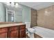 Bathroom showcasing a vanity with granite countertops, a toilet, and a shower-tub combo at 2451 N Rainbow Blvd # 1066, Las Vegas, NV 89108
