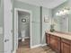 Well-lit bathroom featuring a single sink vanity with granite countertops and dark wood cabinets at 2451 N Rainbow Blvd # 1066, Las Vegas, NV 89108