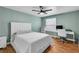 This bedroom features a ceiling fan, wood flooring, and a large window for plenty of natural light at 2451 N Rainbow Blvd # 1066, Las Vegas, NV 89108