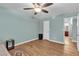 Bedroom with a ceiling fan, hardwood floors, and a connecting bathroom at 2451 N Rainbow Blvd # 1066, Las Vegas, NV 89108