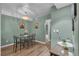 This dining area features wood floors, a glass table, and a chandelier at 2451 N Rainbow Blvd # 1066, Las Vegas, NV 89108
