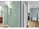 Hallway featuring 'Gathering' wall art and leading to a bedroom at 2451 N Rainbow Blvd # 1066, Las Vegas, NV 89108