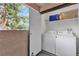 Convenient laundry area with washer, dryer, and storage shelves, ensuring functionality at 2451 N Rainbow Blvd # 1066, Las Vegas, NV 89108