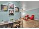 Charming living room offering wood flooring, modern decor, wine-themed artwork, and ample space for entertaining at 2451 N Rainbow Blvd # 1066, Las Vegas, NV 89108